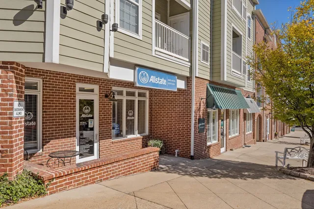 a view of a brick building with many windows
