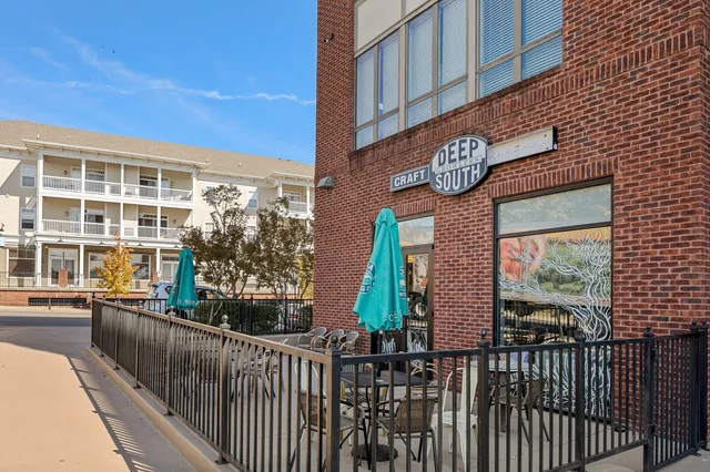 a building with a table and a potted plant