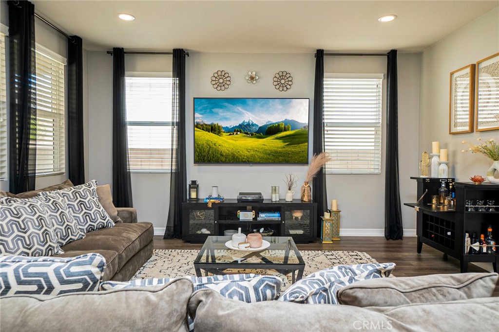 4788 Condor Avenue Fontana, CA 92336 - Photo 14 of 49 a living room with furniture and a flat screen tv