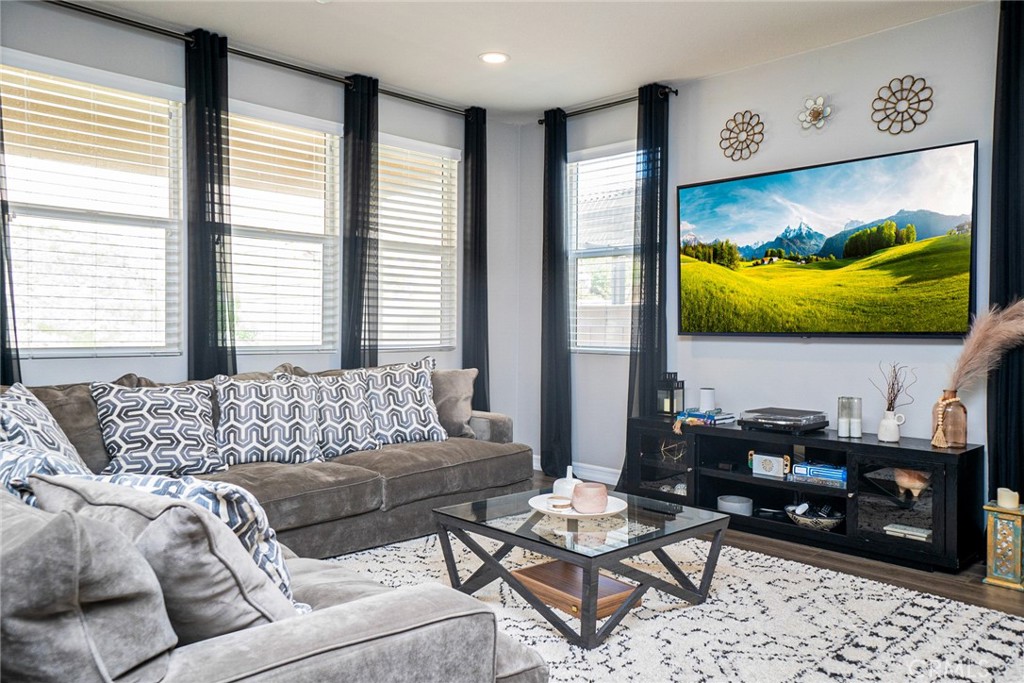4788 Condor Avenue Fontana, CA 92336 - Photo 15 of 49 a living room with furniture and a flat screen tv