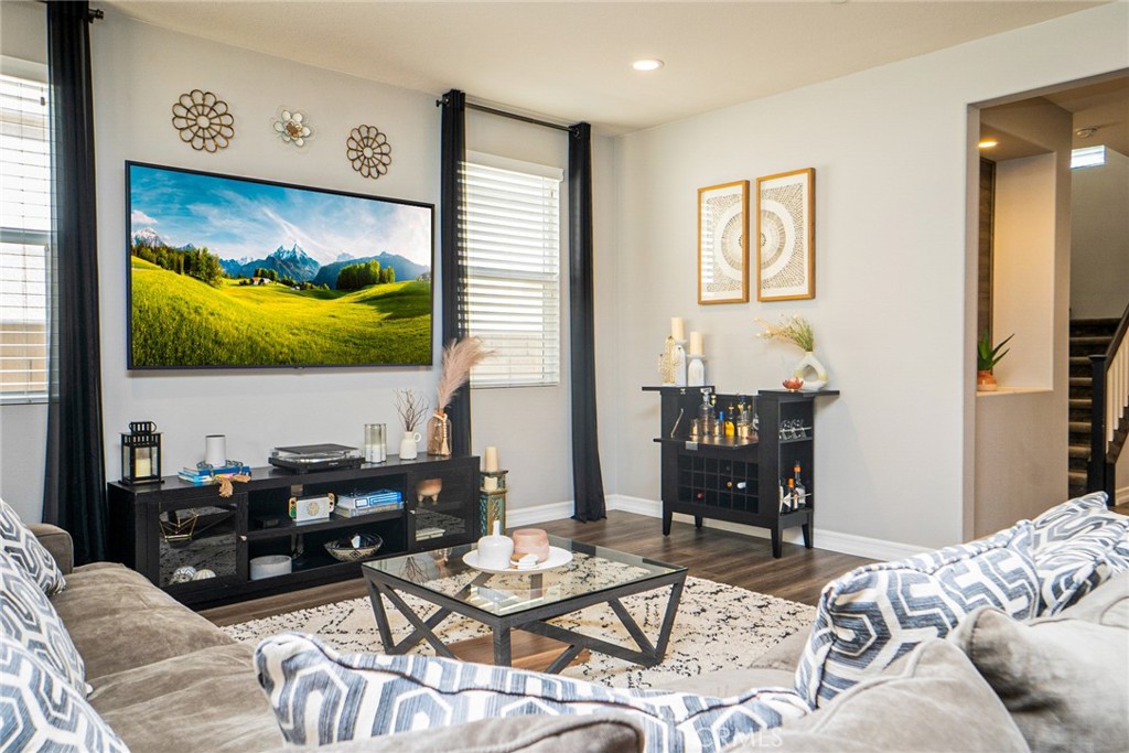 4788 Condor Avenue Fontana, CA 92336 - Photo 16 of 49 a living room with furniture and a flat screen tv