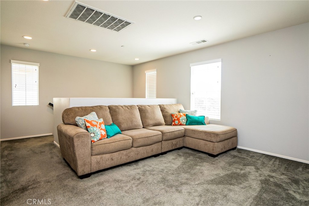 4788 Condor Avenue Fontana, CA 92336 - Photo 24 of 49 a living room with furniture and a window