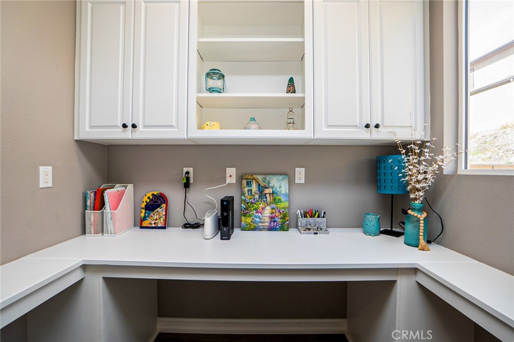 4788 Condor Avenue Fontana, CA 92336 - Photo 26 of 49 a kitchen with white cabinets and a window