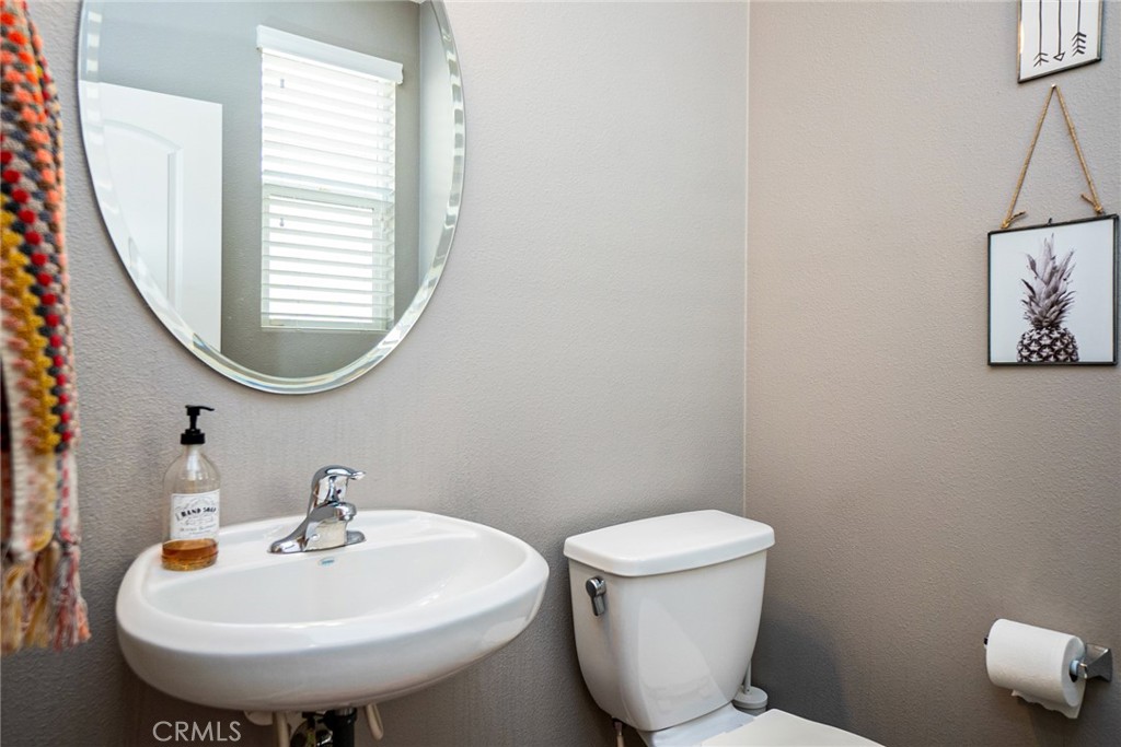 4788 Condor Avenue Fontana, CA 92336 - Photo 27 of 49 a bathroom with a sink and a mirror