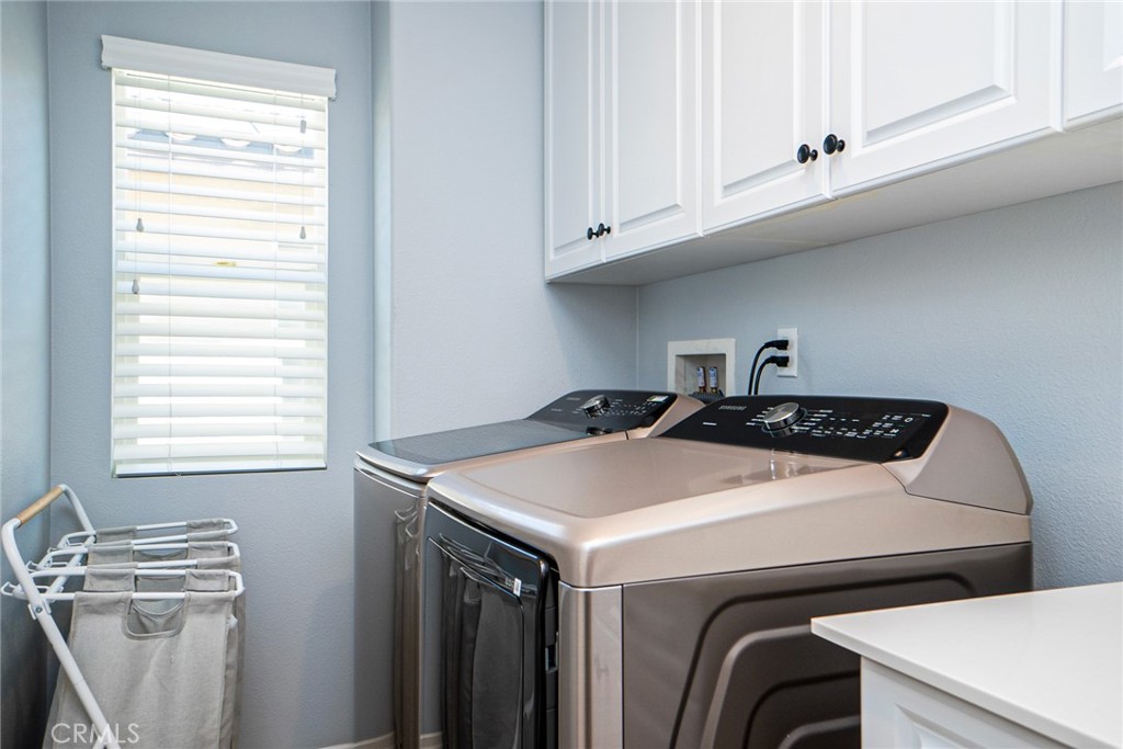 4788 Condor Avenue Fontana, CA 92336 - Photo 28 of 49 a utility room with dryer and washer