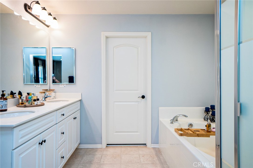 4788 Condor Avenue Fontana, CA 92336 - Photo 29 of 49 a bathroom with a sink and a mirror