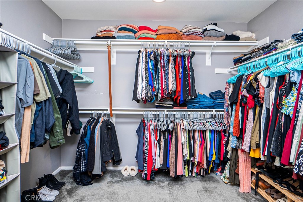 4788 Condor Avenue Fontana, CA 92336 - Photo 33 of 49 a view of walk in closet with clothes