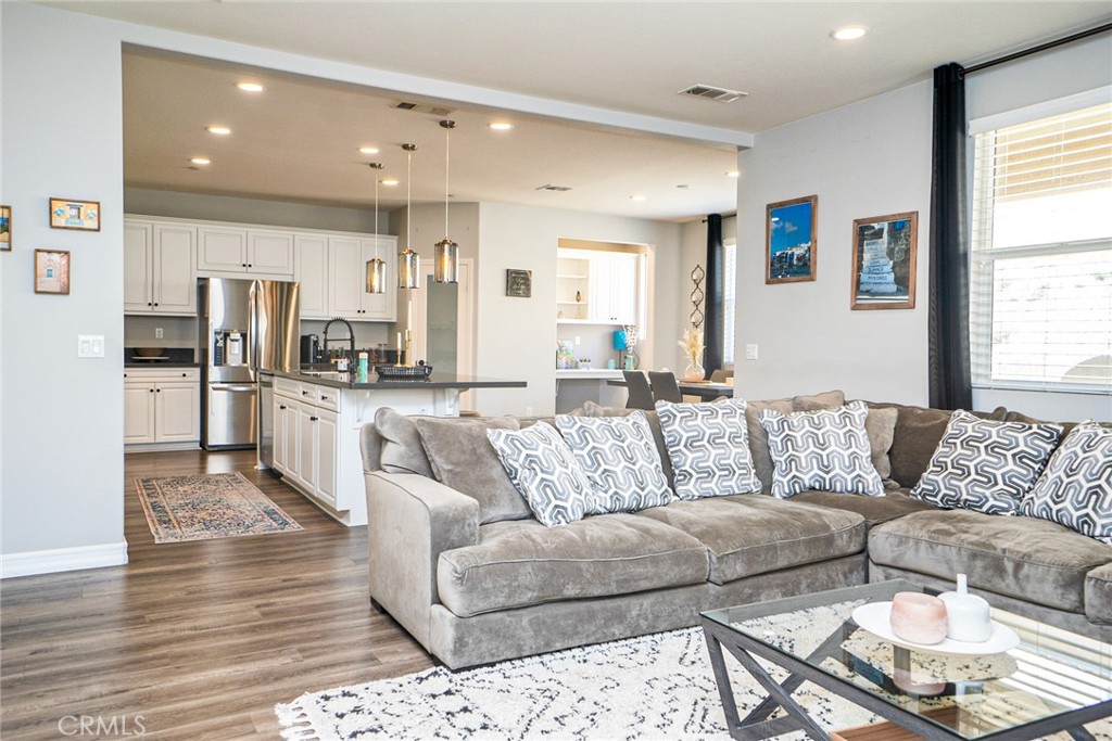 4788 Condor Avenue Fontana, CA 92336 - Photo 5 of 49 a living room with furniture and kitchen view