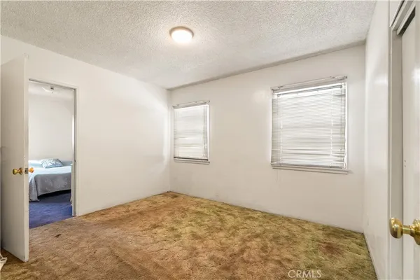 a bed room with a bed and a window