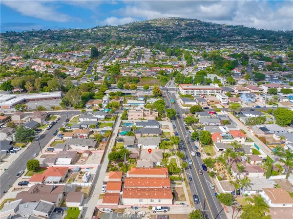 an aerial view of a city with lots of residential buildings