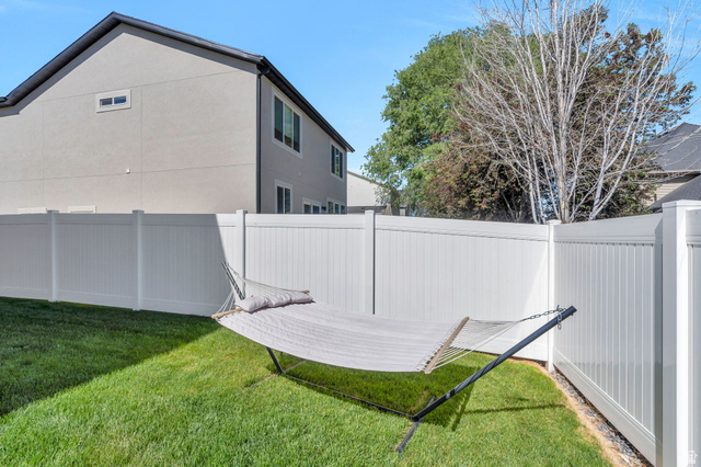 2664 West Maple Street Mapleton, UT 84664 - Photo 46 of 49 Expansive green lawn framed by a white privacy fence