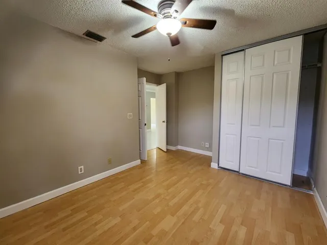 a white toilet sitting next to a bath tub shower