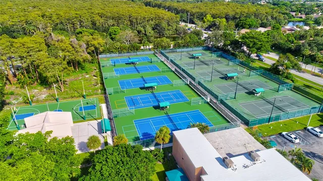 an aerial view of residential house with outdoor space and swimming pool