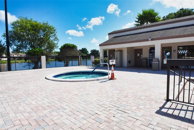 a view of a swimming pool with a patio