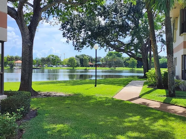 an empty room with closet and a bathroom