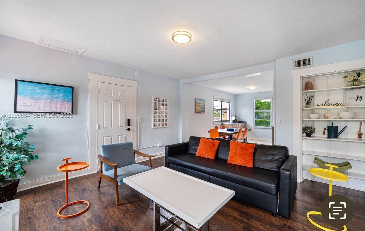 2255 Southwest 10th Street, Unit B Miami, FL 33135 - Photo 8 of 26 a living room with furniture and wooden floor