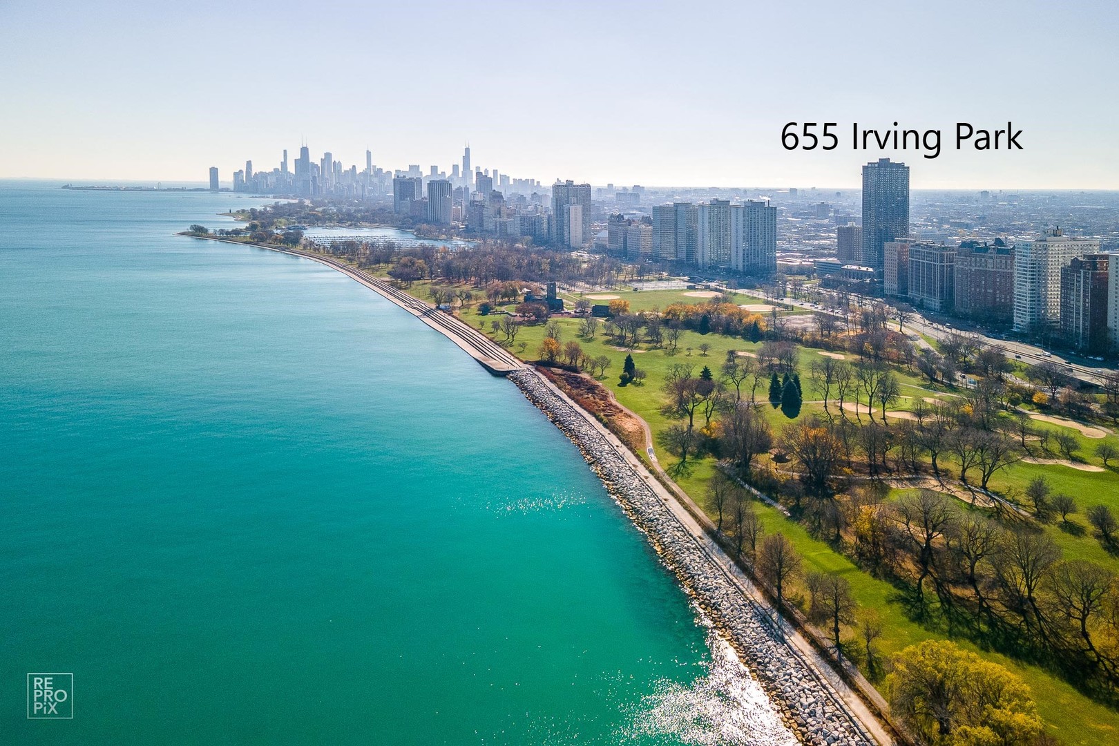 655 West Irving Park Road, Unit 3717 Chicago, IL 60613 - Photo 11 of 22 a view of a lake with a wall