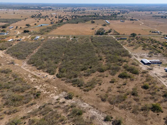 an aerial view of beach and ocean