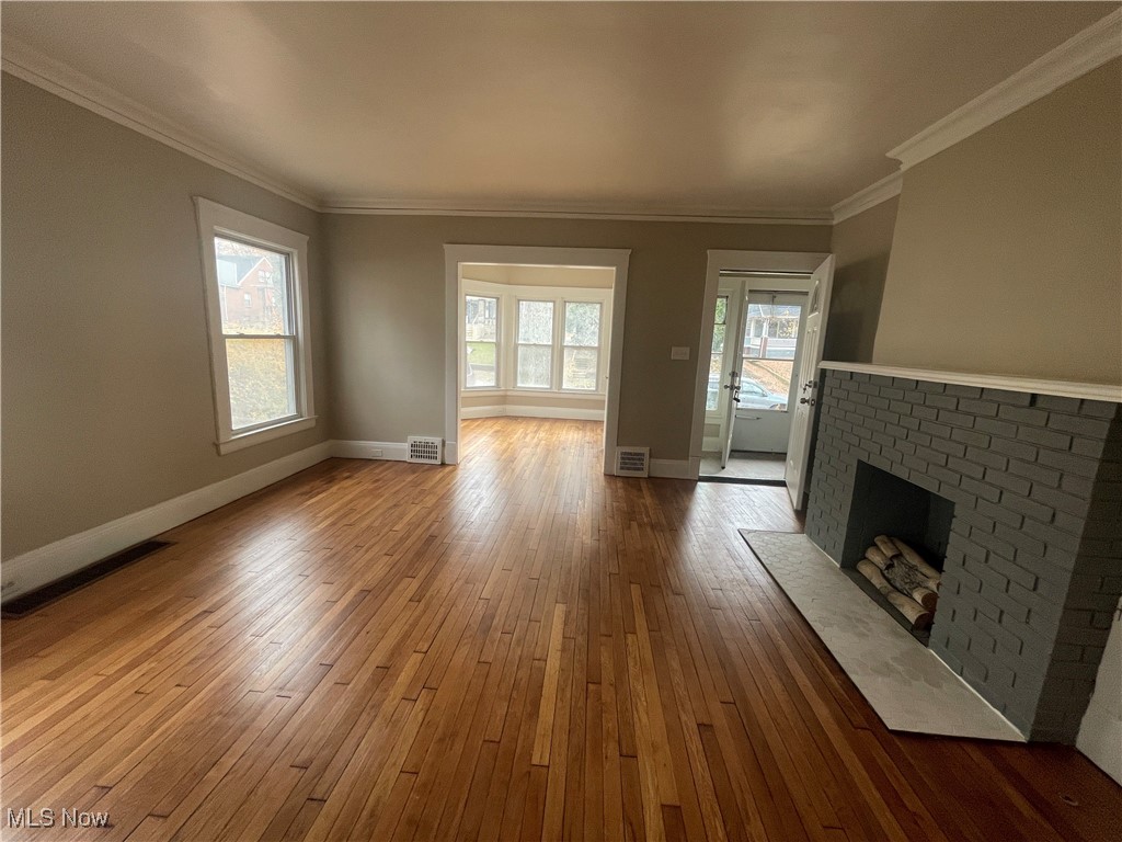 3235 Oak Road Cleveland, OH 44118 - Photo 4 of 47 Main living space with faux fireplace and refinished hardwood floors