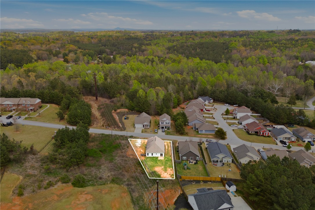 245 Maple Grove Road Seneca, SC 29678 - Photo 37 of 40 An aerial perspective showcases a vibrant residential community nestled within a lush, verdant landscape.