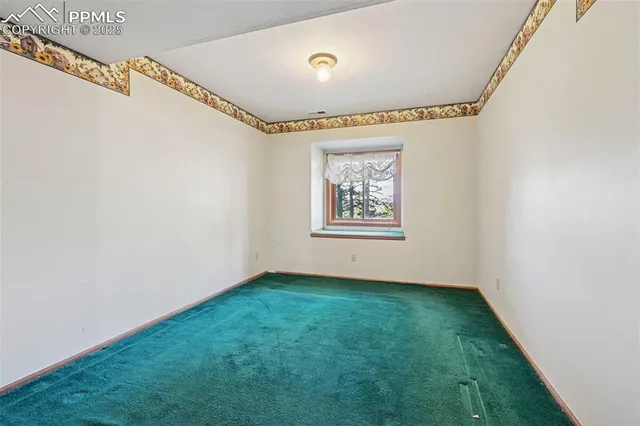 a view of a room with window and a projector