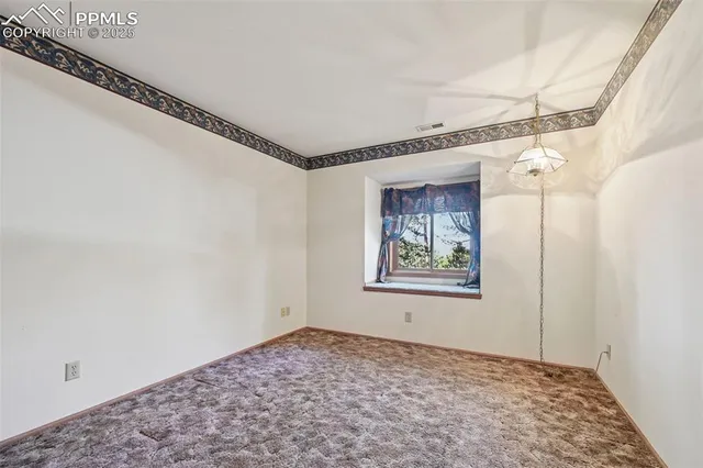 a view of a hallway with a window