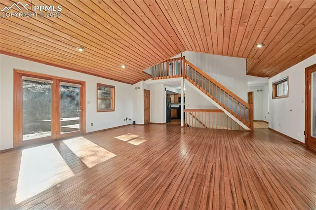 a view of a livingroom with wooden floor