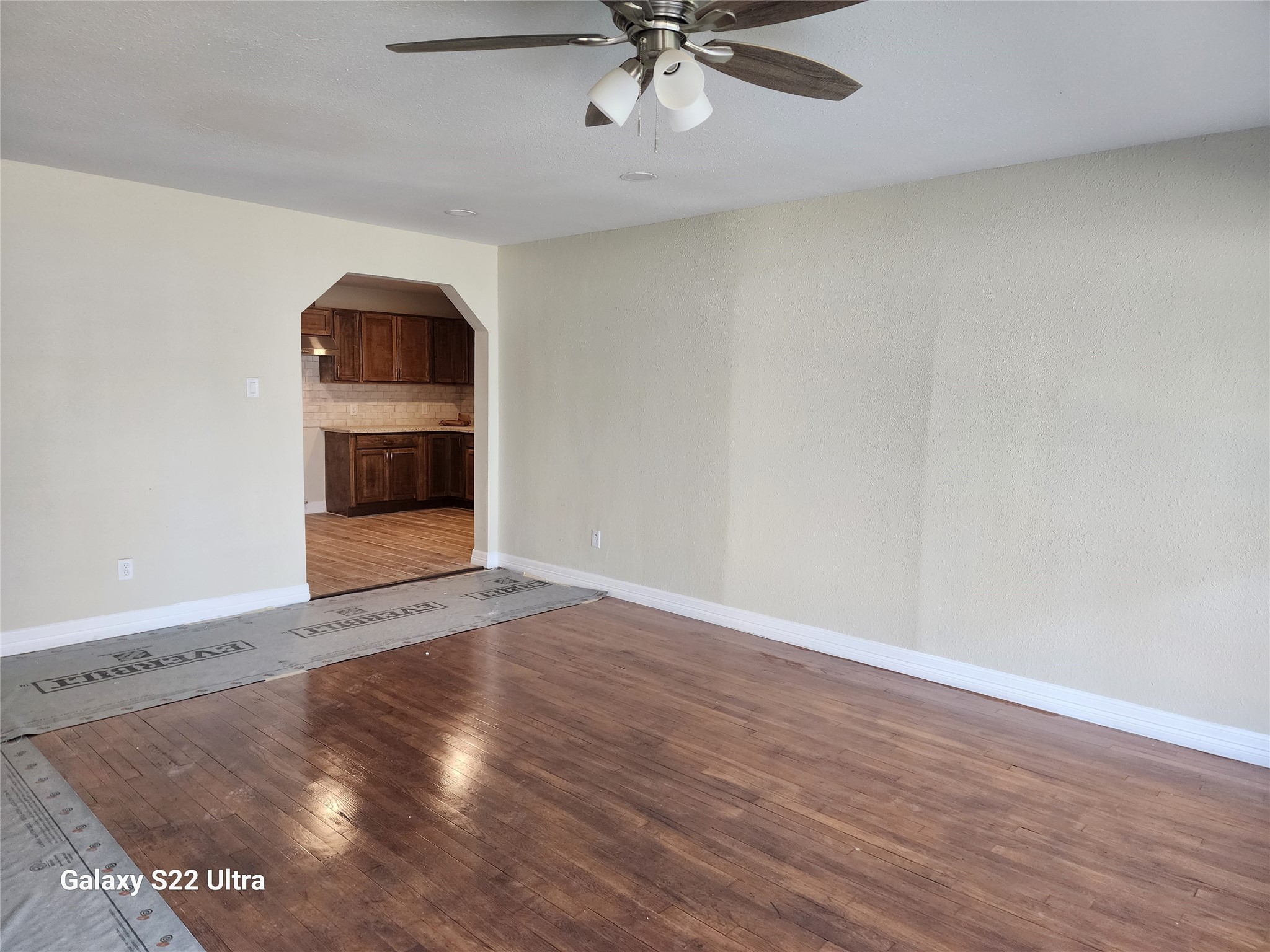 702 McDaniel Street, Unit A Houston, TX 77022 - Photo 5 of 11 wooden floor in an empty room with a window