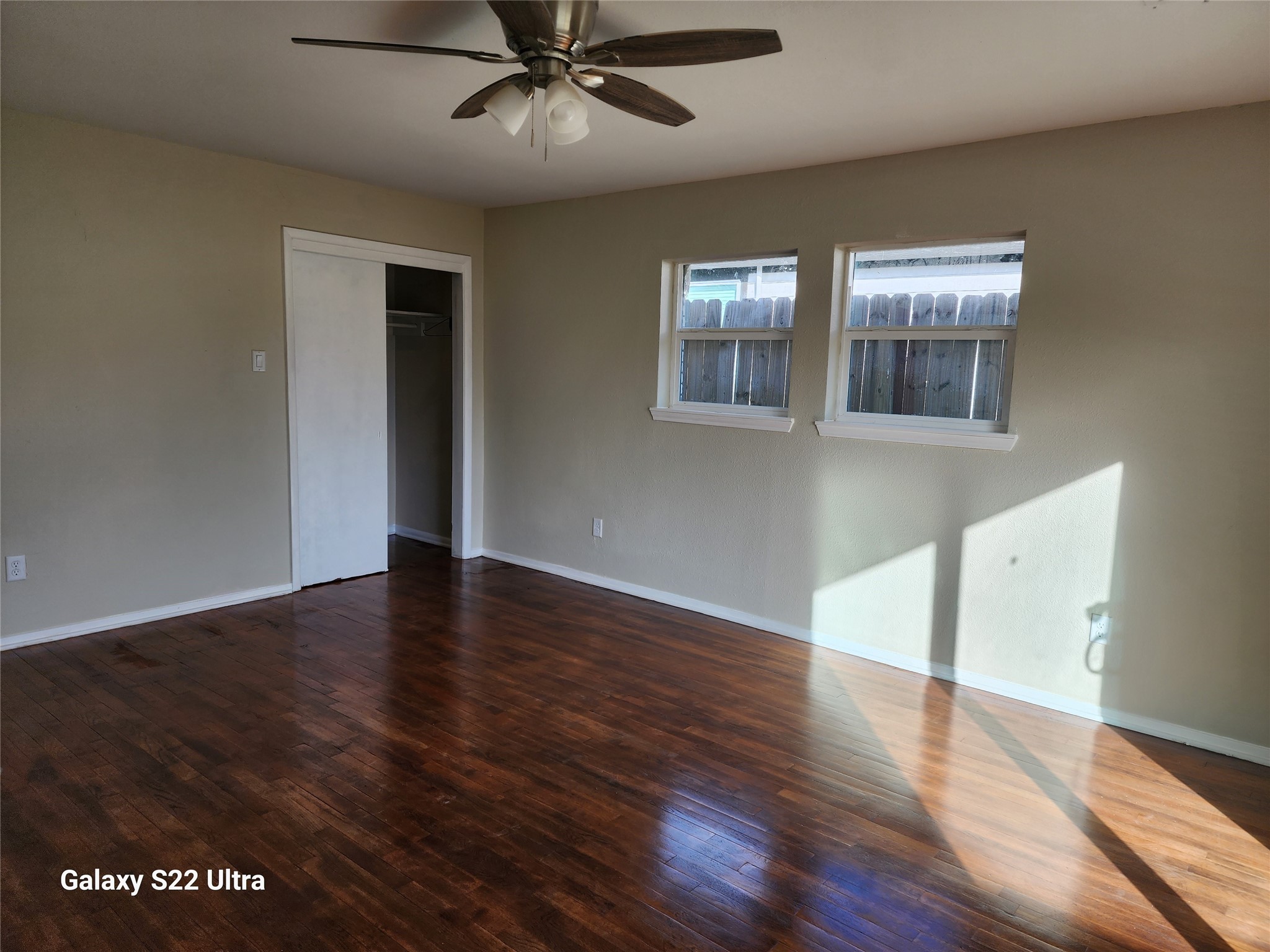 702 McDaniel Street, Unit A Houston, TX 77022 - Photo 7 of 11 a view of an empty room with wooden floor and a window