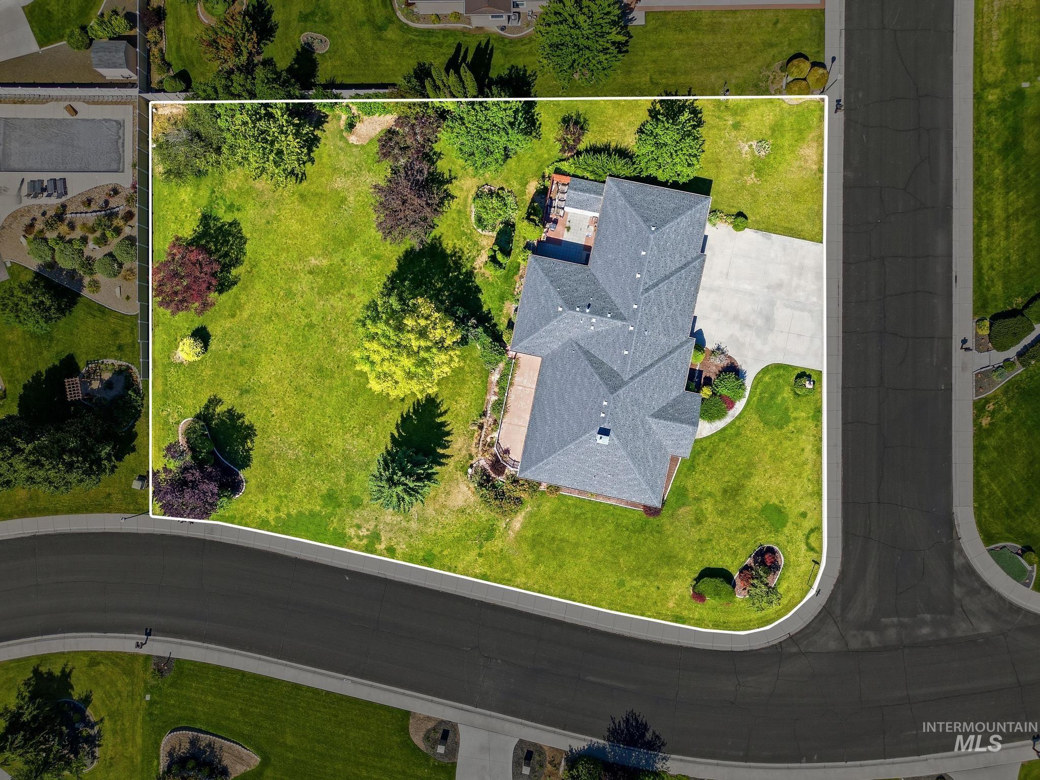 15181 Drury Way Caldwell, ID 83607 - Photo 2 of 49 Expansive property featuring a multi-gabled roofline, concrete driveway, and a substantial grassy area