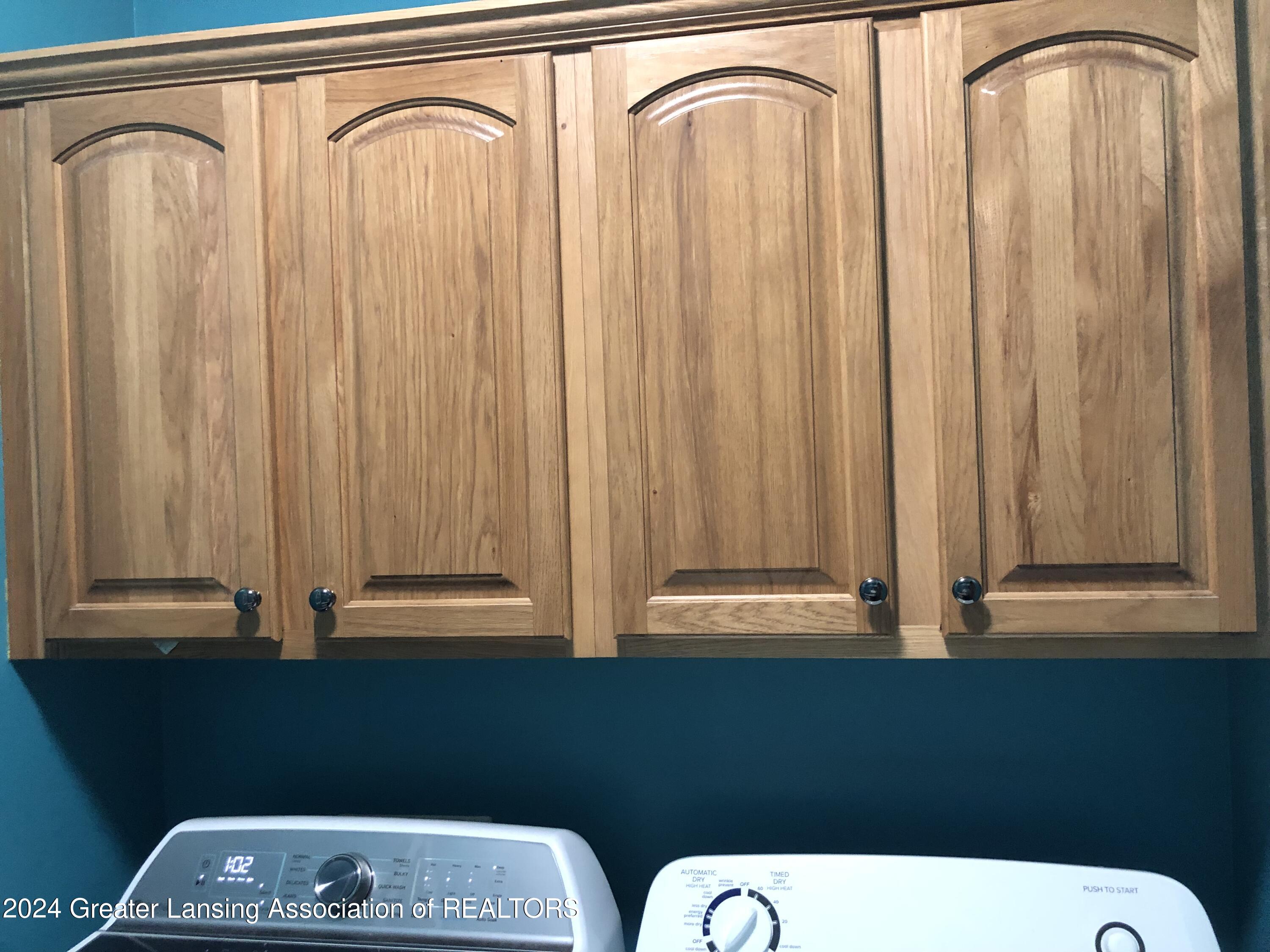 3848 Sandhill Road Lansing, MI 48911 - Photo 16 of 33 Laundry Room Cabinets
