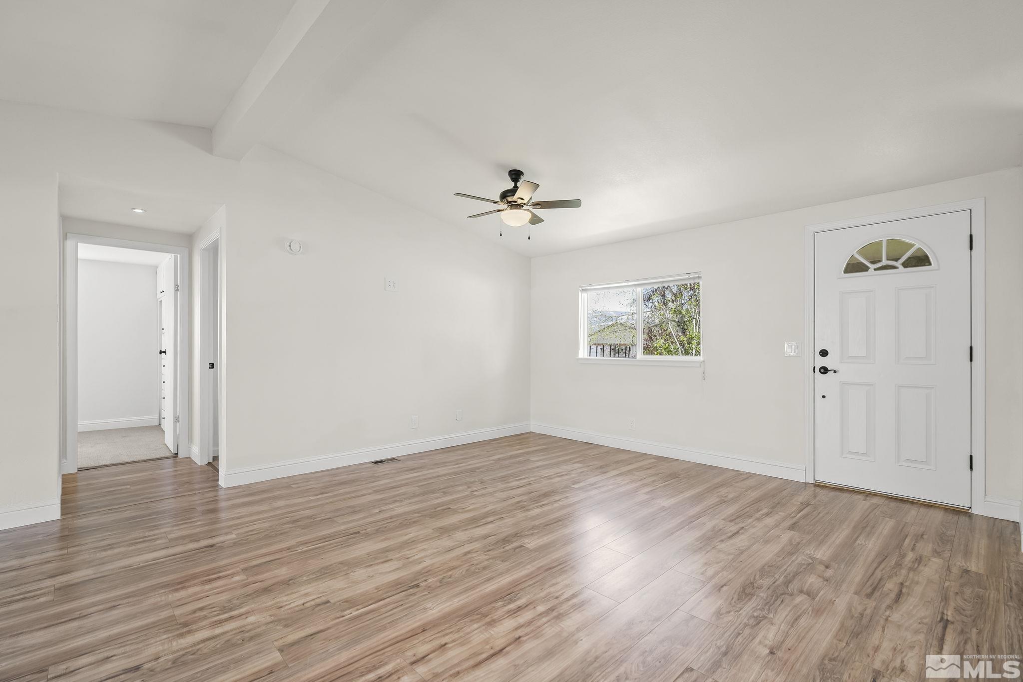 3858 Puffin Street Reno, NV 89508 - Photo 3 of 35 an empty room with fan and windows