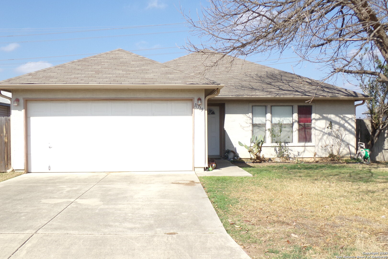 a view of a house with a yard and sitting area