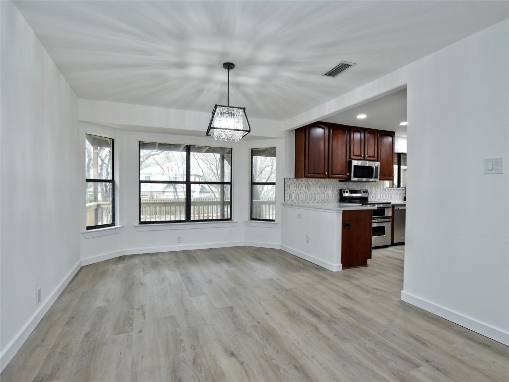 307 Copperleaf Road Lakeway, TX 78734 - Photo 12 of 28 a view of kitchen with sink microwave refrigerator and cabinets