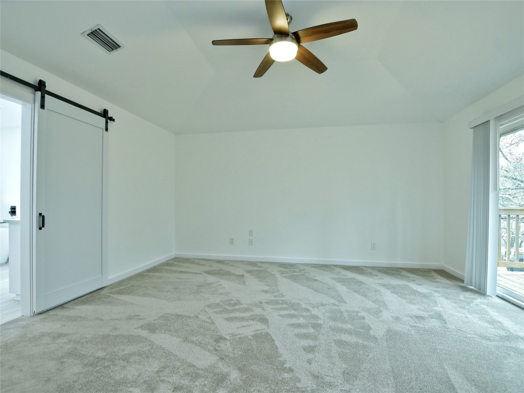 307 Copperleaf Road Lakeway, TX 78734 - Photo 20 of 28 an empty room with a window and a fan
