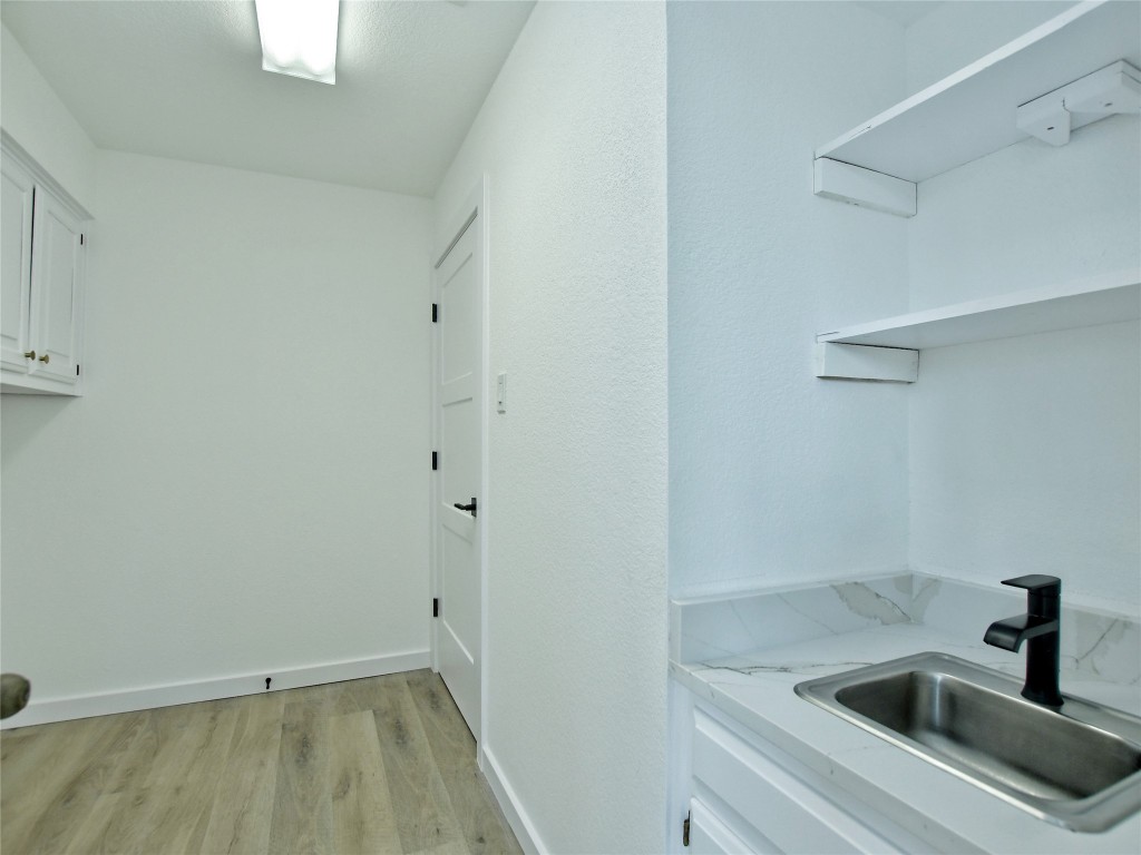 307 Copperleaf Road Lakeway, TX 78734 - Photo 25 of 28 a bathroom with a sink and tap