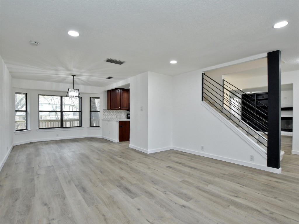 307 Copperleaf Road Lakeway, TX 78734 - Photo 8 of 28 a view of an empty room with a window and fireplace