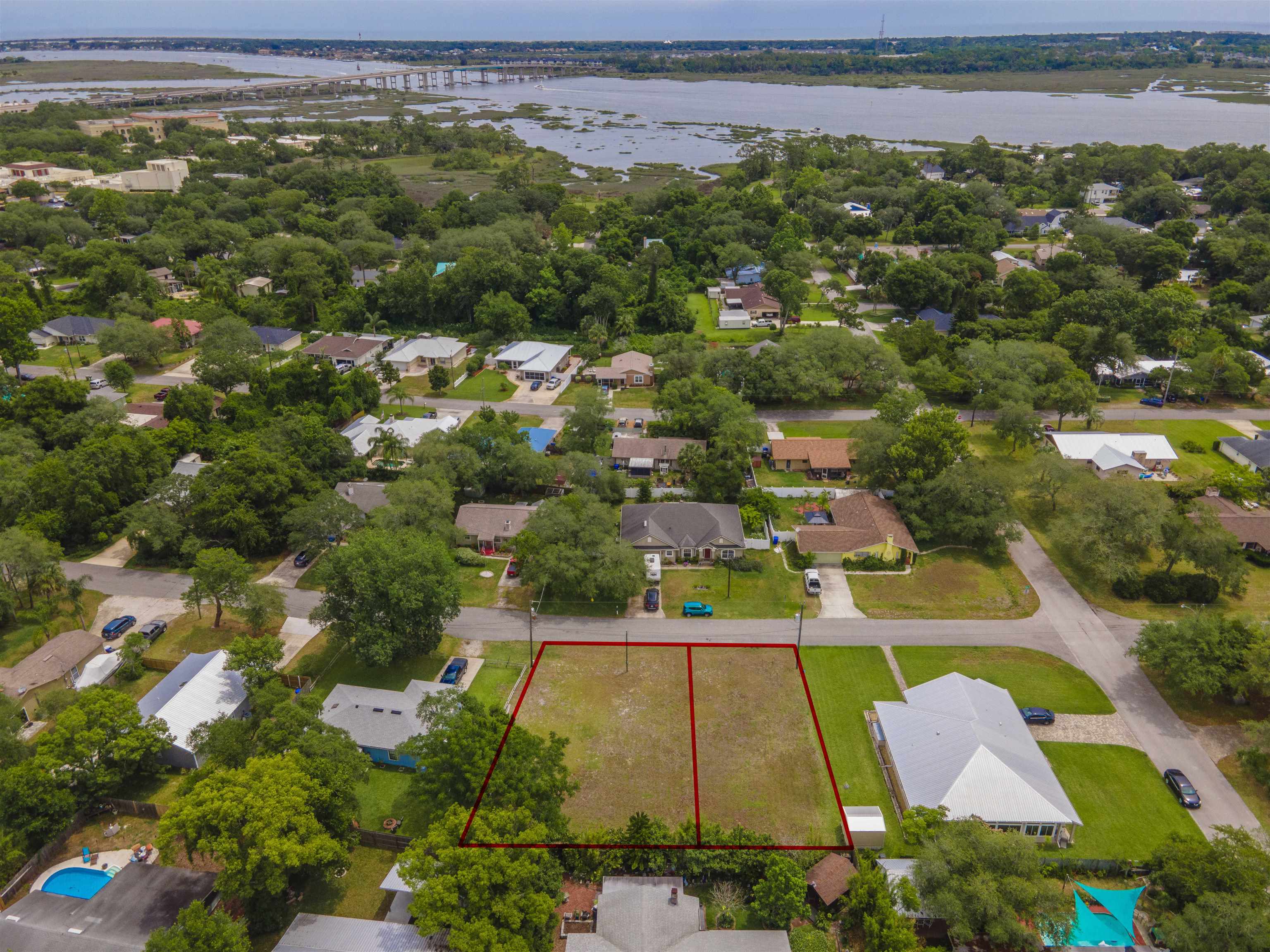 103 Sea Fox Road St. Augustine, FL 32086 - Photo 3 of 12 an aerial view of residential houses with outdoor space and swimming pool