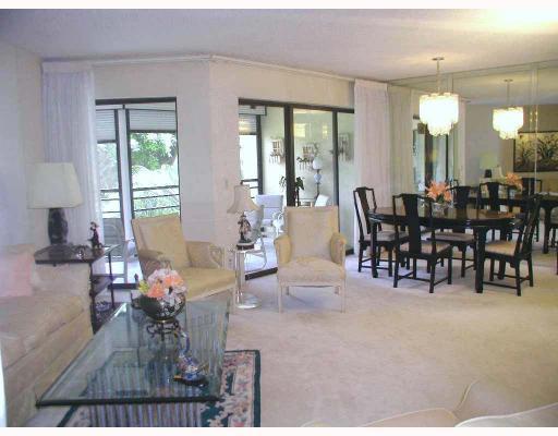 5700 Camino Del Sol, Unit 304 Boca Raton, FL 33433 - Photo 3 of 14 a view of a dining room with furniture window and outside view