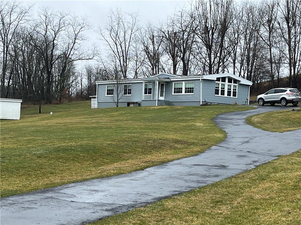 49 Cedar Grove Road Avella, PA 15312 - Photo 1 of 16 a front view of a house with a garden and trees