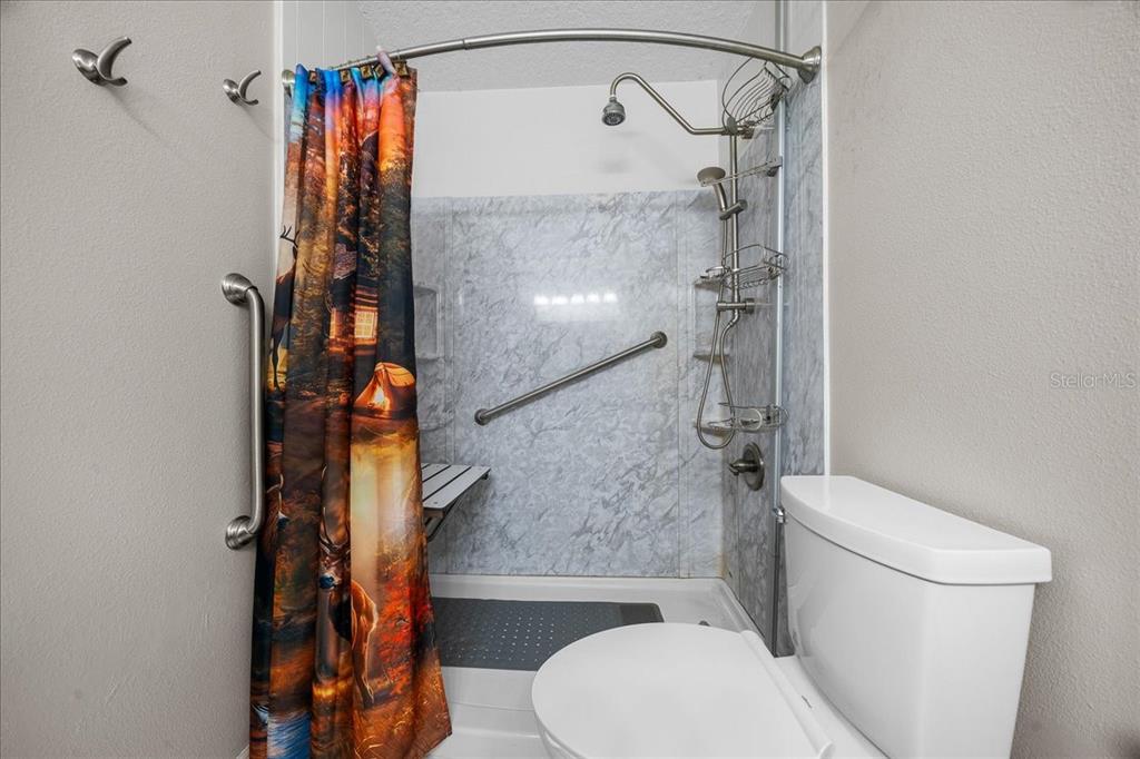 12575 West Edwards Court Inglis, FL 34449 - Photo 20 of 39 a bathroom with a toilet and a shower