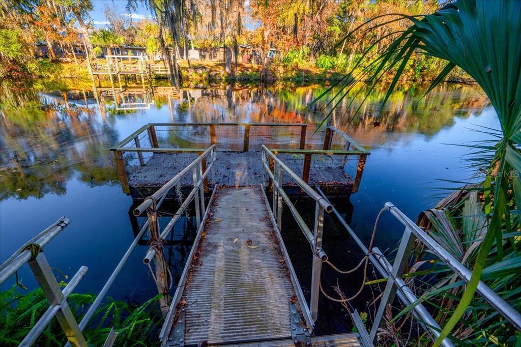 12575 West Edwards Court Inglis, FL 34449 - Photo 29 of 39 a view of balcony with wooden floor and fence