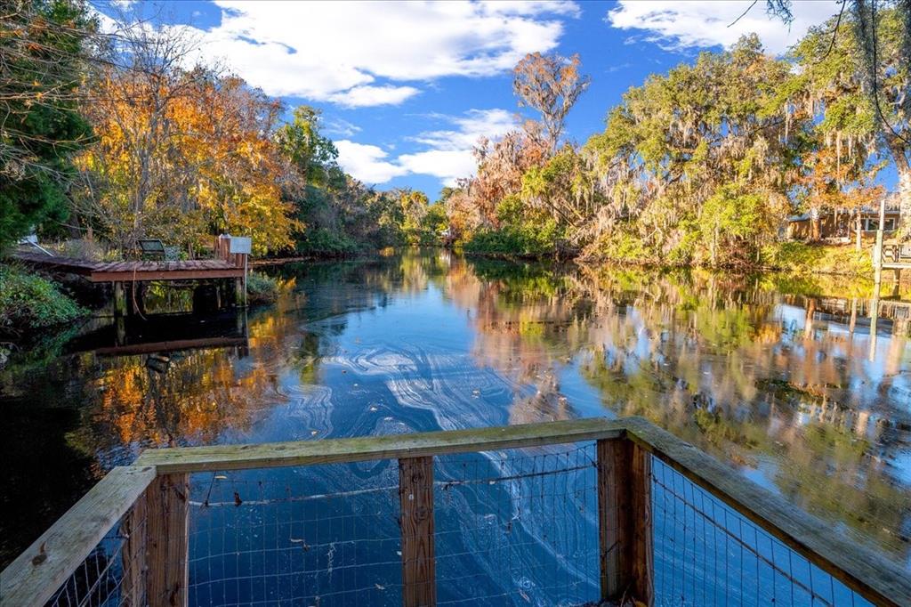 12575 West Edwards Court Inglis, FL 34449 - Photo 30 of 39 a view of a lake from a balcony