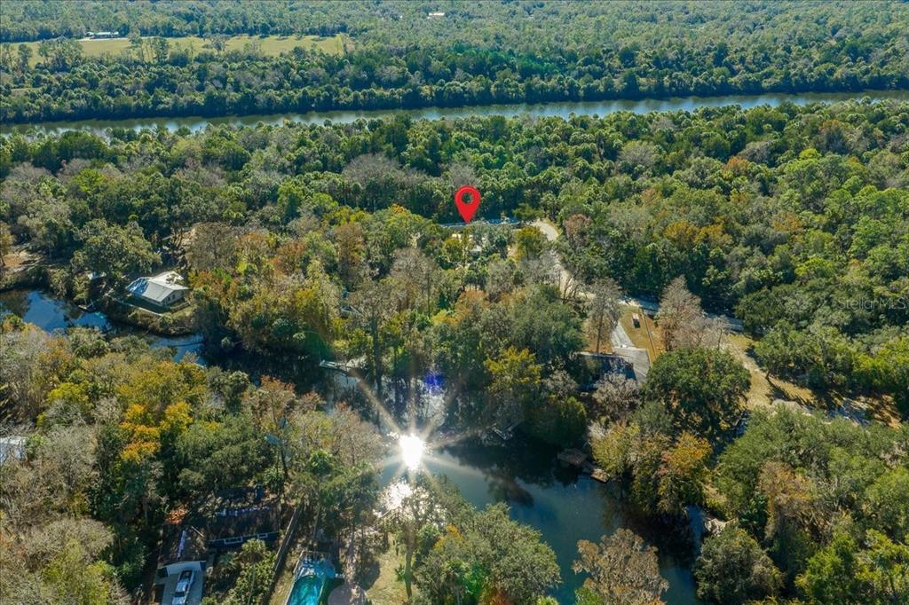 12575 West Edwards Court Inglis, FL 34449 - Photo 34 of 39 a view of a lake with a houses