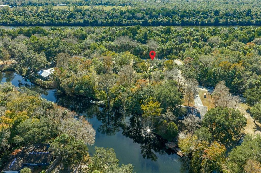 12575 West Edwards Court Inglis, FL 34449 - Photo 38 of 39 a aerial view of a house with a yard and lake view
