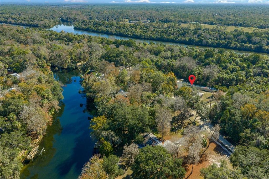 12575 West Edwards Court Inglis, FL 34449 - Photo 39 of 39 an aerial view of residential house with outdoor space and lake view