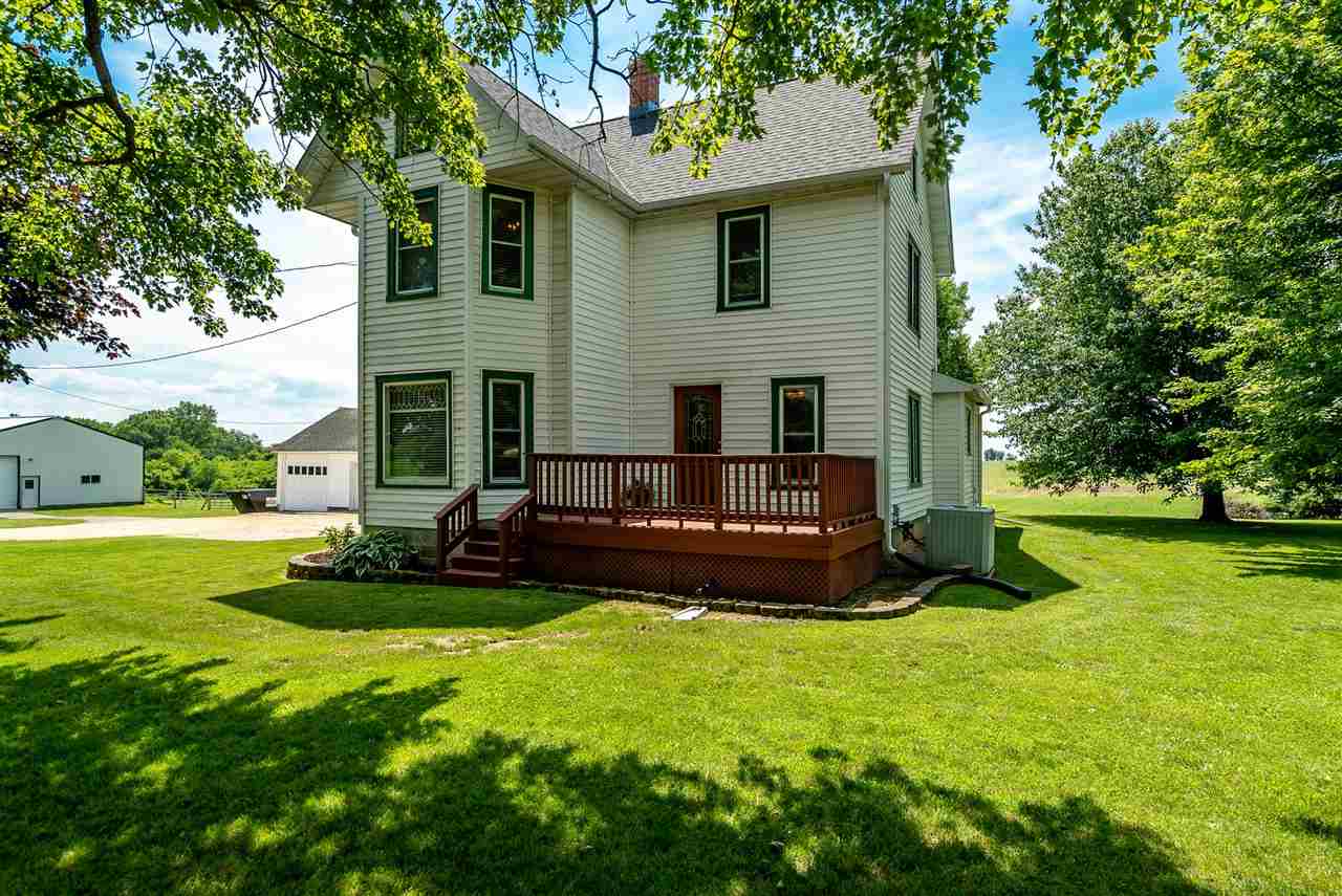 9691 East Cedarville Road Davis, IL 61019 - Photo 1 of 39 a view of a house with a yard and sitting area