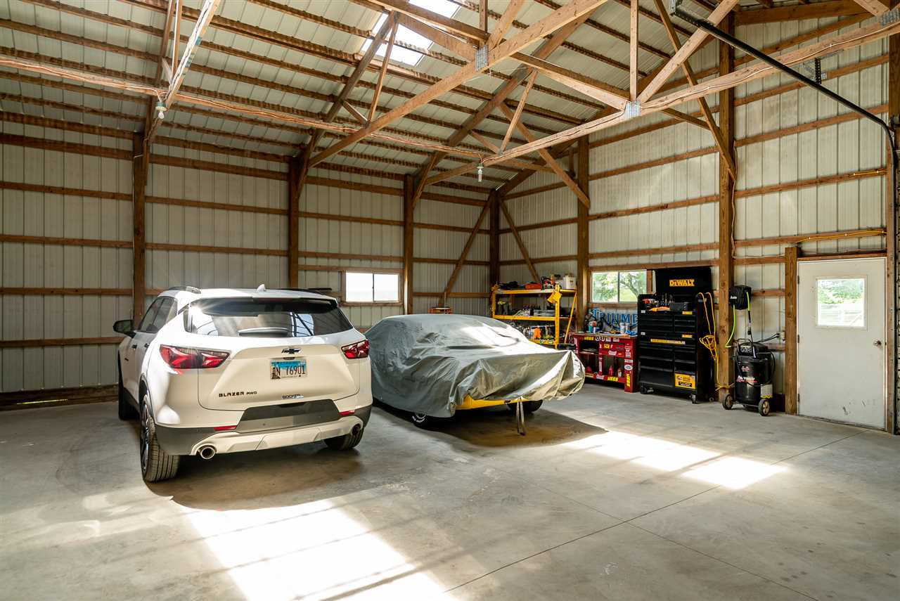 9691 East Cedarville Road Davis, IL 61019 - Photo 11 of 39 a car parked in a garage