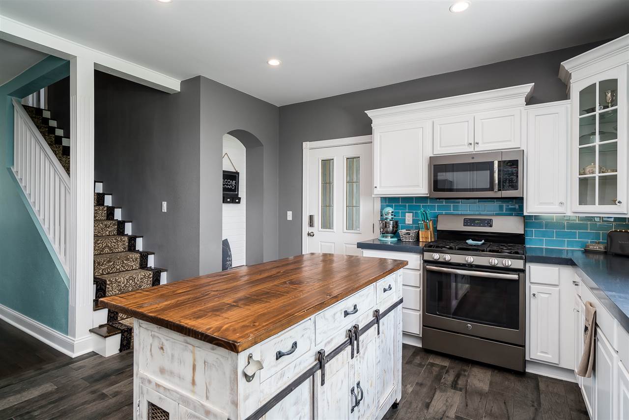9691 East Cedarville Road Davis, IL 61019 - Photo 23 of 39 a kitchen with a stove and a microwave