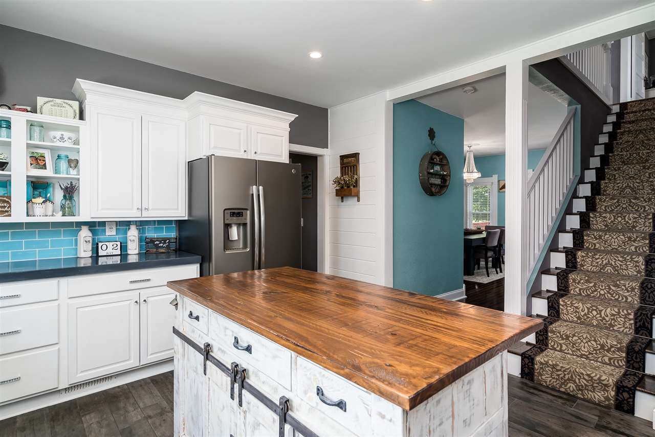 9691 East Cedarville Road Davis, IL 61019 - Photo 24 of 39 a kitchen with refrigerator and cabinets